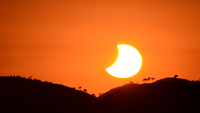 A solar eclipse at sunset
