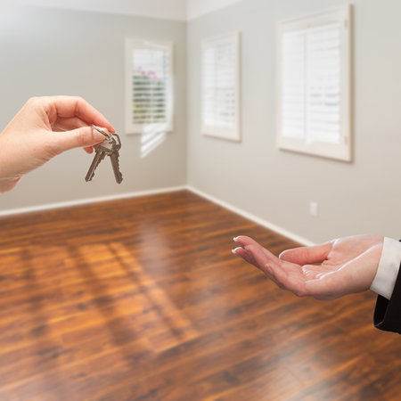 Keys being handed over inside an empty apartment as Spain launches payments for owners of vacant properties.