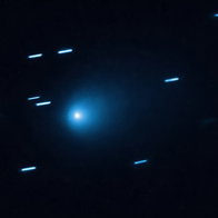 Interstellar comet 3I/ATLAS captured against a starry background as it travels through the solar system
