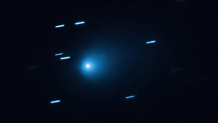 Interstellar comet 3I/ATLAS captured against a starry background as it travels through the solar system