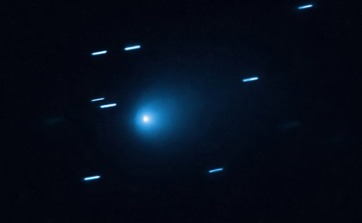 Interstellar comet 3I/ATLAS captured against a starry background as it travels through the solar system