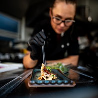 A chef from Gastro Moon Restaurante in Almoradi putting the finishing touches to a dish.
