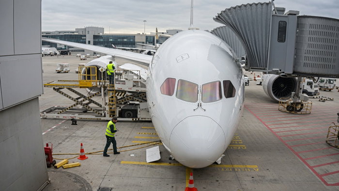 An airplane with a collapsed landing gear