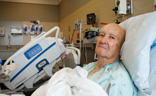 Patient Sitting Up in Modern Hospital Room