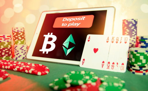 Tablet screen showing a bitcoin symbol with hearts playing cards at the side