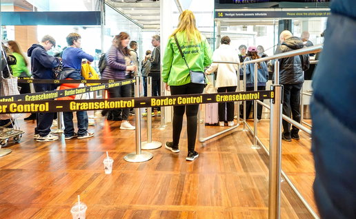 Travellers queue at a European airport border control checkpoint following the launch of new EU migration, visa and identity verification systems.