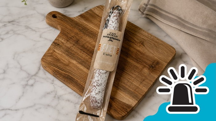 Packaged Can Duran Fuet Extra placed on a wooden chopping board, the product named in Spain’s salmonella food alert