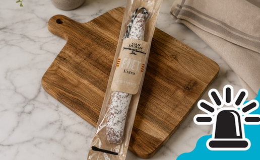 Packaged Can Duran Fuet Extra placed on a wooden chopping board, the product named in Spain’s salmonella food alert