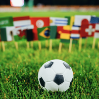 Football in front of national flags of many countries.