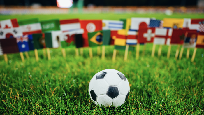 Football in front of national flags of many countries.
