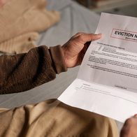 Man holding an eviction notice