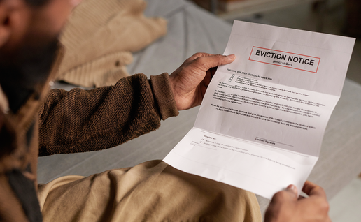 Man holding an eviction notice