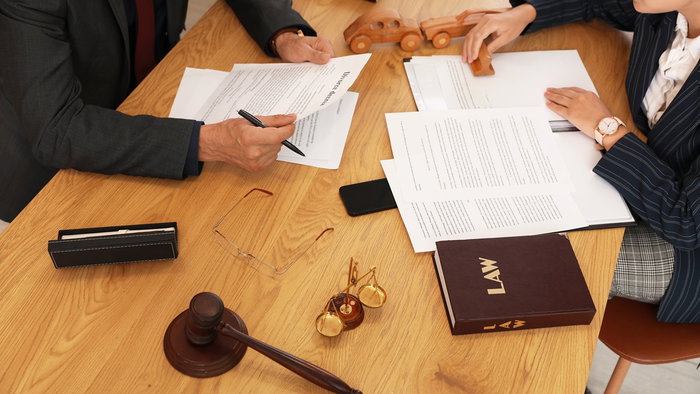 Legal documents on a desk as lawmakers debate proposed changes to long term residency rules in Spain.