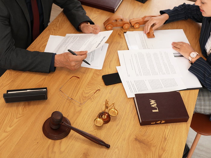 Legal documents on a desk as lawmakers debate proposed changes to long term residency rules in Spain.