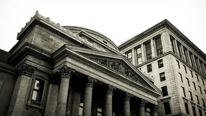 View of a grey finance building in a city
