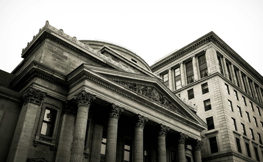View of a grey finance building in a city