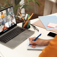 Woman sitting at a desk at home working from her laptop