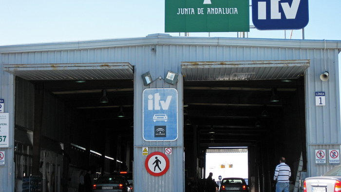 Vehicles undergo mandatory roadworthiness inspections at an ITV testing station in Andalusia