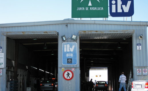 Vehicles undergo mandatory roadworthiness inspections at an ITV testing station in Andalusia