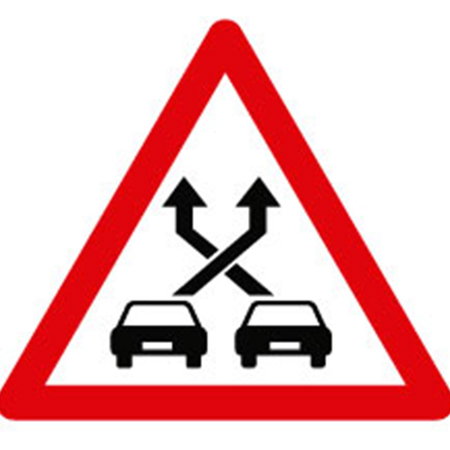 Spain's new P-35 road sign warns drivers that they are approaching a weaving lane where entering and exiting traffic cross paths.