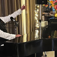 Dave Lewis entertains at private event.