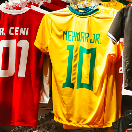 Football shirts hanging in a store
