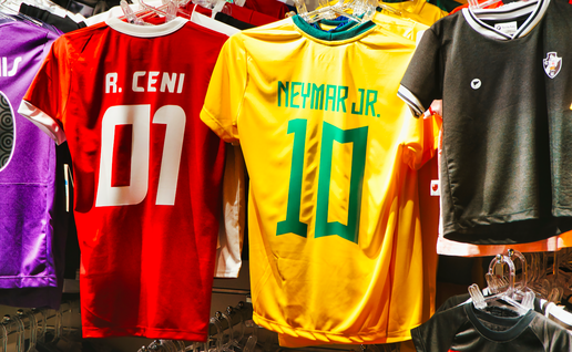 Football shirts hanging in a store
