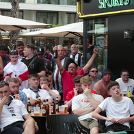 England fans sitting outside a bar