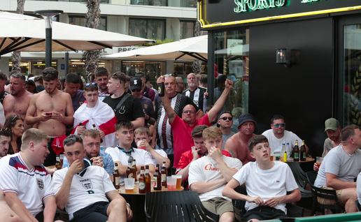 England fans sitting outside a bar