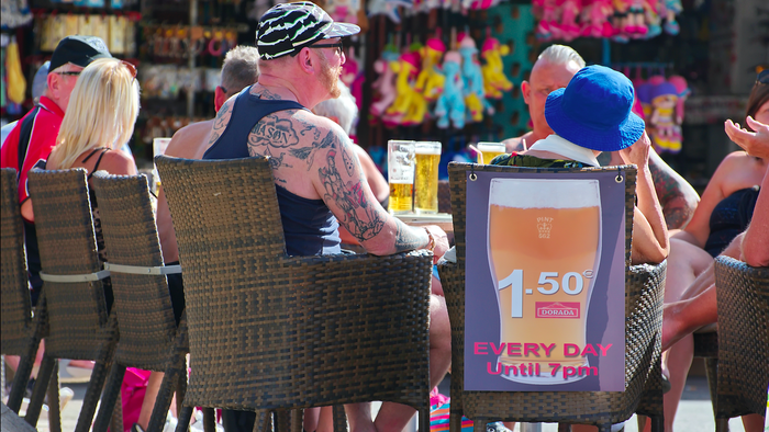 British tourists sitting down at a terrace bar in Tenerife
