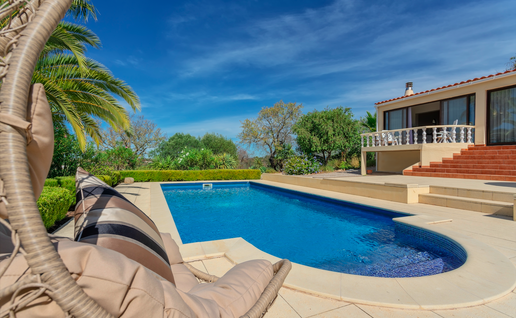 Luxury villa in Portugal with a pool and palm trees