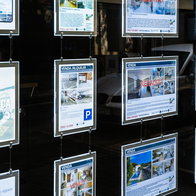 Property listings displayed in the window of a Spanish estate agency, as Spain's Tax Agency launches inspections into suspected tax fraud in the real estate sector.