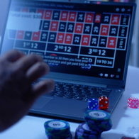 Man sitting relaxed at home playing online casino at his home
