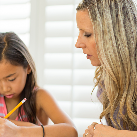 Teacher tutoring child
