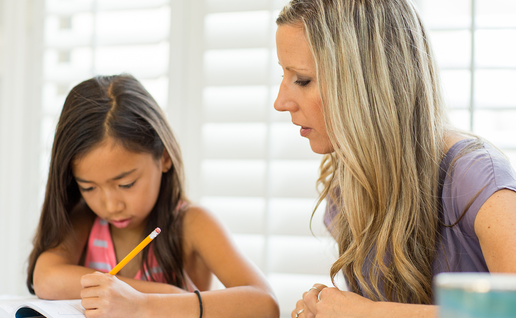 Teacher tutoring child