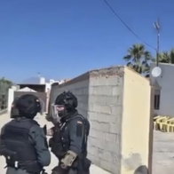 Guardia Civil officers raid Alhaurin home.
