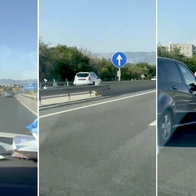 White Dacia Duster heading the wrong way.