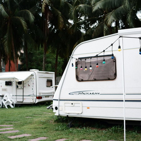 View of caravans parked up in a field