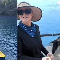 Amy Schumer enjoys a spot of paddleboarding and interacts with the famous wild goats
