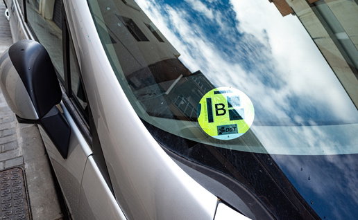DGT environmental sticker displayed on a car windscreen in Spain.