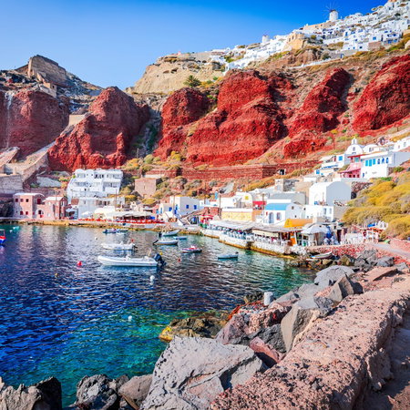 Colourful coastal village and harbour on Santorini, one of Greece's most popular tourist destinations.
