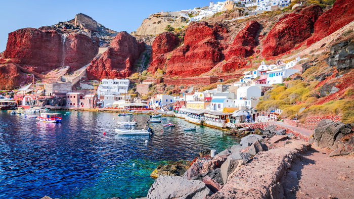 Colourful coastal village and harbour on Santorini, one of Greece's most popular tourist destinations.