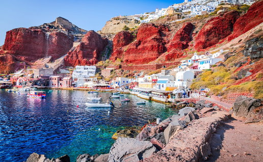 Colourful coastal village and harbour on Santorini, one of Greece's most popular tourist destinations.