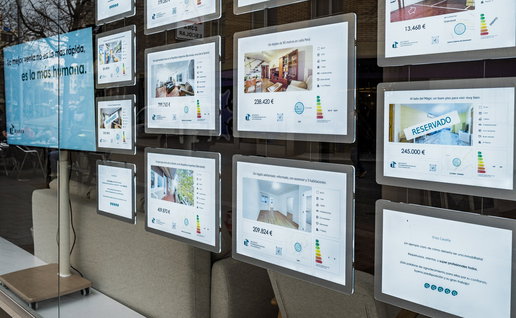 Property listings displayed in the window of a Spanish estate agency as house prices continue to rise across the country.
