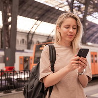A young woman at a station.