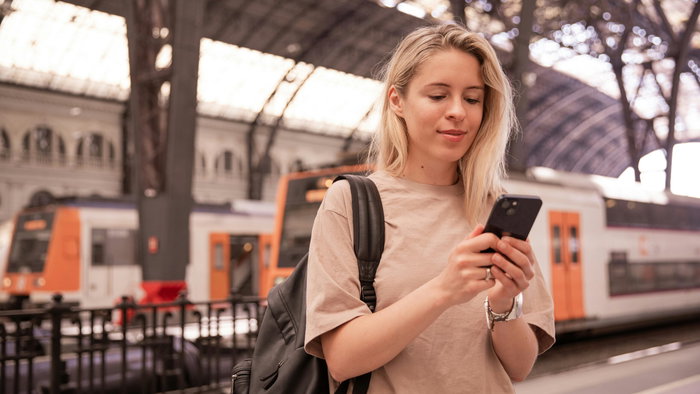 A young woman at a station.