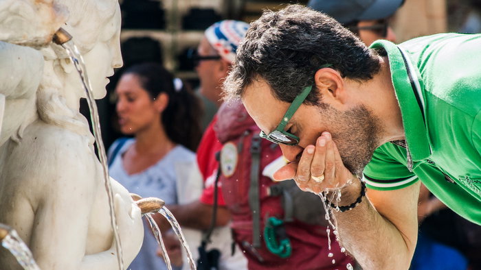 Keeping hydrated during the hottest hours.