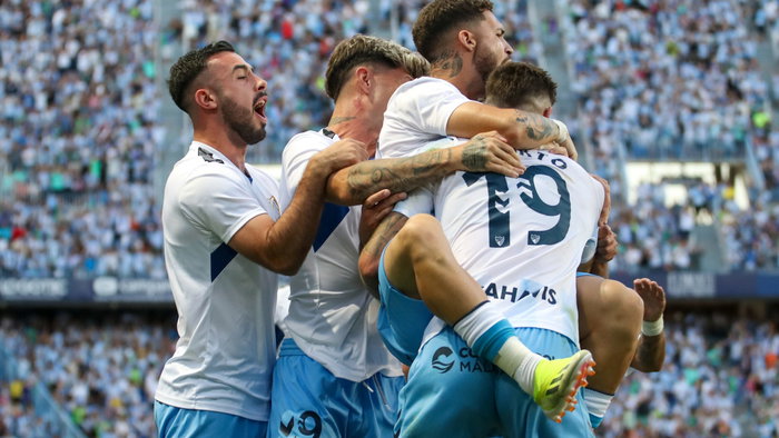 Malaga CF players celebrate a goal