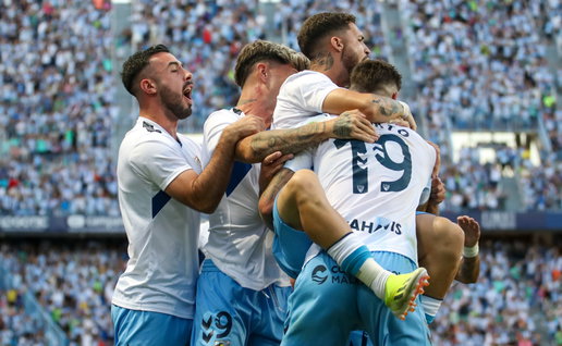 Malaga CF players celebrate a goal