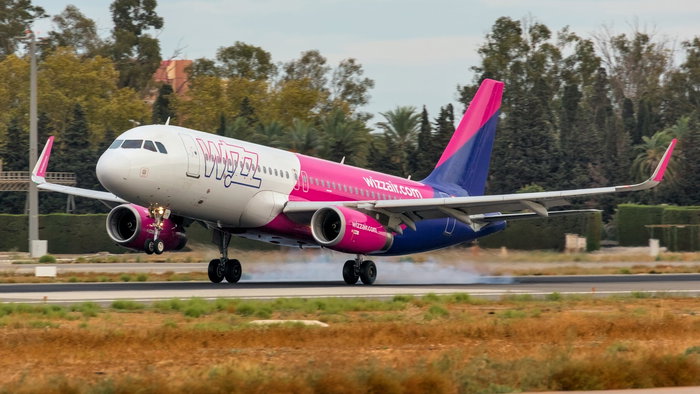 An aircraft lifting off from Malaga Airport